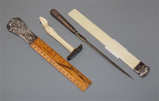 A silver moulded ivory letter opener and three other silver mounted items